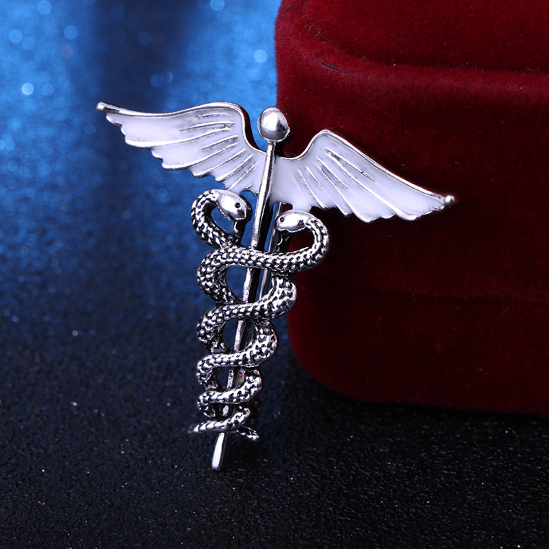 solid color Angel Wings with inlaid hollow Snake Brooch