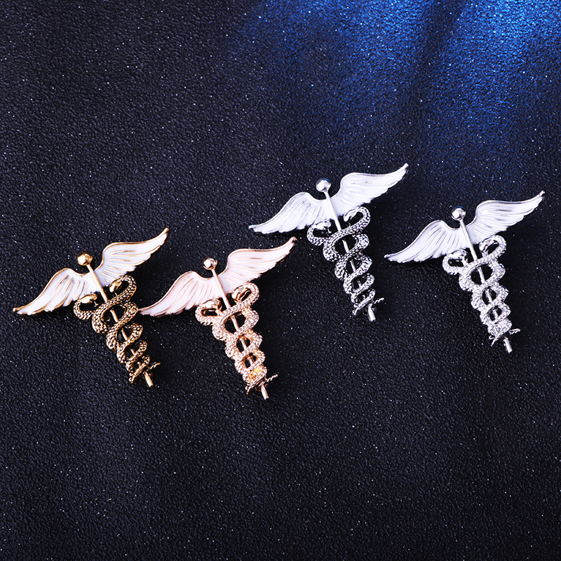 solid color Angel Wings with inlaid hollow Snake Brooch