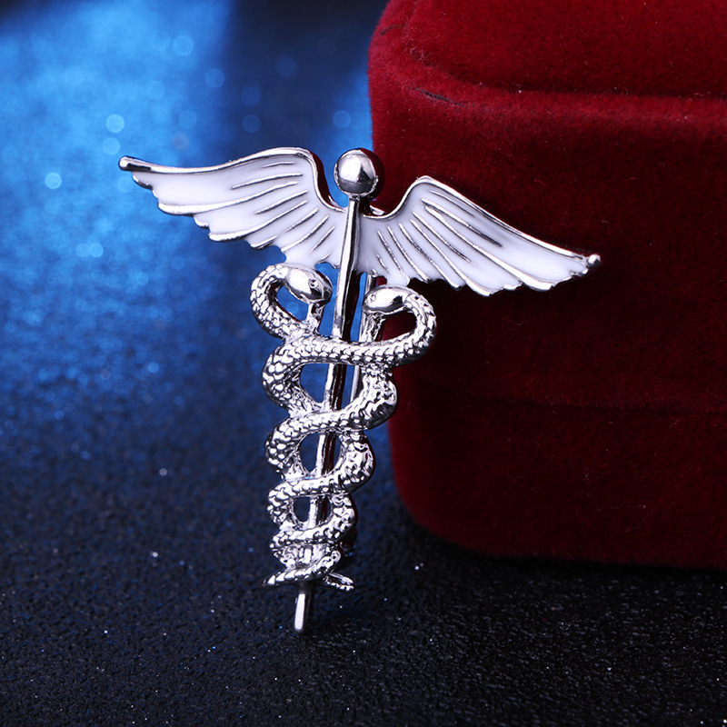 solid color Angel Wings with inlaid hollow Snake Brooch