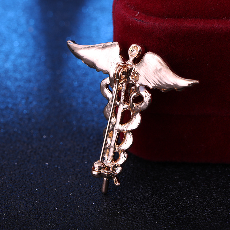 solid color Angel Wings with inlaid hollow Snake Brooch