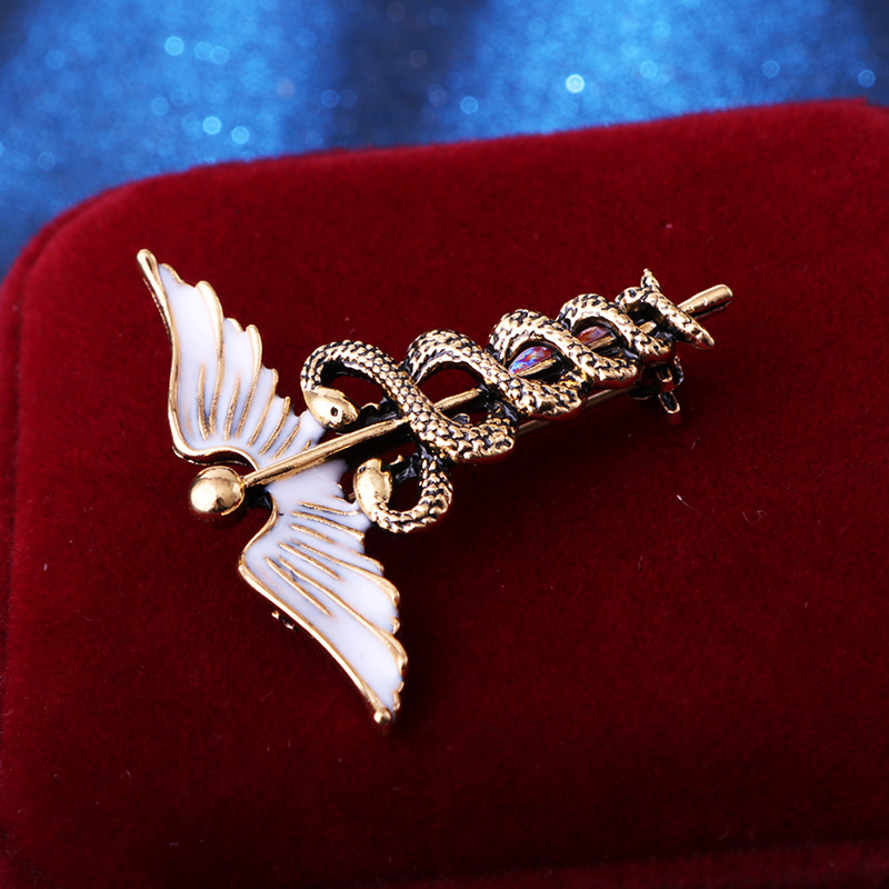 solid color Angel Wings with inlaid hollow Snake Brooch