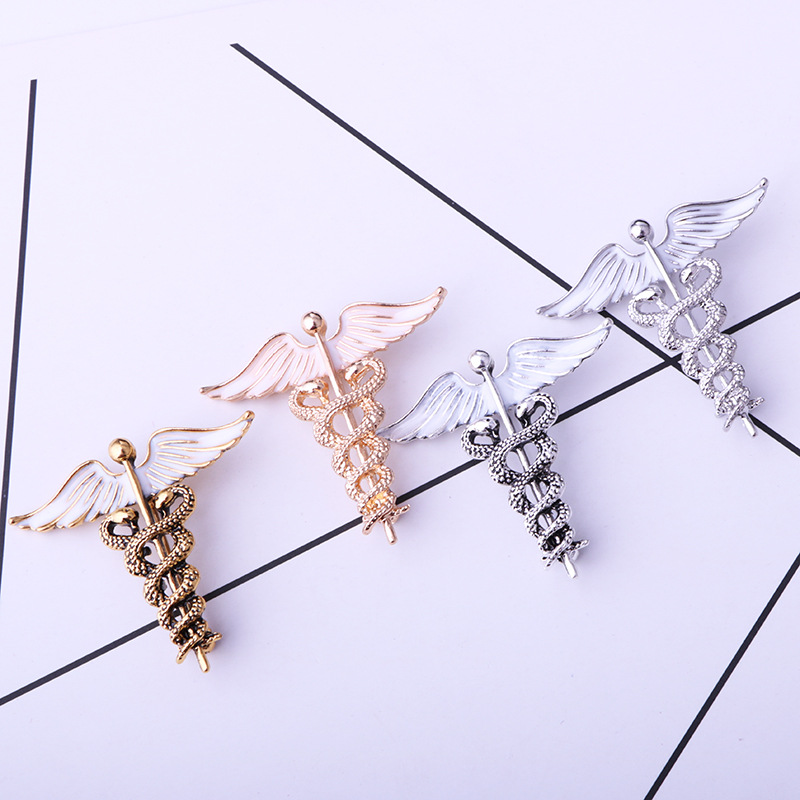 solid color Angel Wings with inlaid hollow Snake Brooch